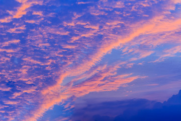 Wall Mural - Colorful with red, orange and blue dramatic sky on the clouds for abstract background. Romantic sunset background with beautiful blue, red and yellow clouds.