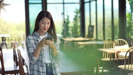 Sticker - happy woman using smartphone in a cafe