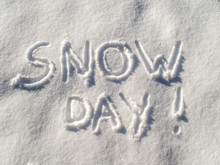 Words "Snow Day!" Written In Fresh Fallen Snow With Copy Space.