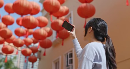 Poster - Woman take photo on cellphone with red lantern