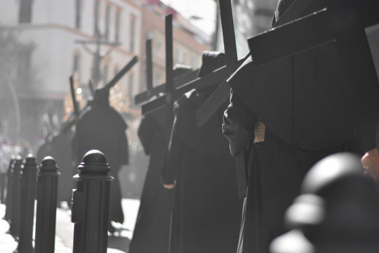 the processions of the penitents with crosses on their shoulders