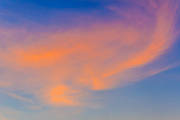 Wall Mural -  Red clouds on blue sky in twilight evening. Beautiful sunset sky with blue and red background. Dramatic colorful of dusk and dawn sky with blue sky and red clouds.