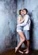 © LanaK - happy beautiful young couple against the wall
