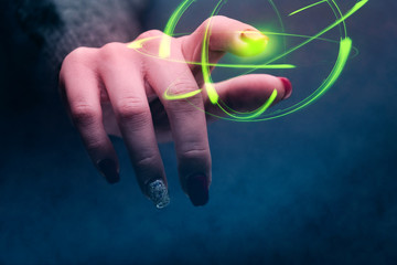 Poster - Woman forefinger touches green atom. Mixed media.