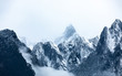 © Guiyuan - Snowy mountains in the clouds