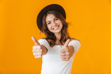 Wall Mural - Portrait of a cheerful young woman wearing white shirt