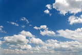 Fototapeta Niebo - many white clouds against the blue sky