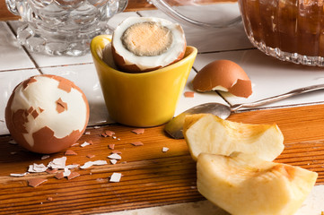 boiled egg with pieces of peeled apple