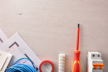 Wall Mural - Equipment on table for electrical installation of housing blank above