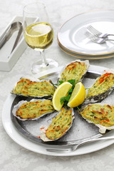 Wall Mural - oysters rockfeller, baked oysters on half shell topped with green sauce and bread crumbs