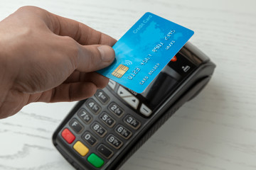 POS terminal, Payment Machine with credit card isolated on white background. Contactless payment with NFC technology.