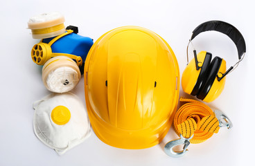 Set of safety equipment on white background, top view