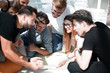 © ASDF - group of young entrepreneurs discuss the strategy of the business project .