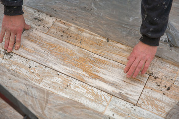 laying floor tiles on the building adhesive