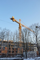 Construction crane against the blue sky