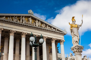 The Athena Fountain in front of the historical Austrian Parliament Building completed in 1883 and located on the Ringstrabe boulevard in the first district of Vienna