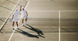 © Jacob Lund - Tennis players giving a high five to each other