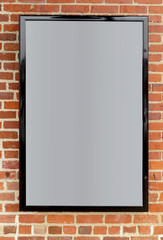 Wall Mural - Blank information poster frame mounted on brick wall. Copy space.ot with DxO ONE