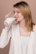 © Akm - girl drinks milk and is happy