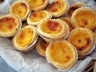  Traditional homemade egg tart fresh and fragrant, tasty warm, crusty, bakery in a white wooden box, street food