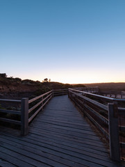  Empty wooded walkway at Great Ocean Road, VIC, Australia at dawn time.