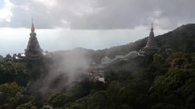Footage Of Drone Flying Over The Temple Doi Inthanon (Doi Luang)  In Chiang Mai In Thailand With Some Clouds Passing By