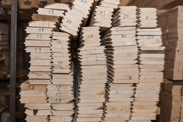 Wall Mural - Lumber butts. Boards clad in piles. Euro race, blockhouse, timber emitation.