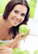 © vgstudio - happy smiling woman with green apples, indoors