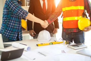 Wall Mural - Agreement between the employer and architect Nick and desk of Architectural project in construction site or office