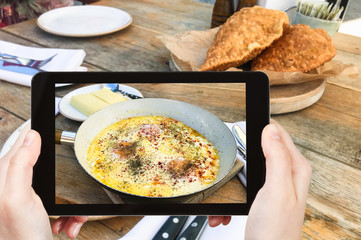 Canvas Print - fried eggs in kabardian style in pan and hominy