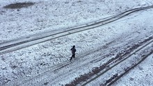  Drone 4k Top View Of A Woman Running In The Outdoors At Winter. Aerial Active Track Shot