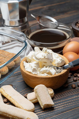 Ingredients for making traditional italian cake tiramisu on wooden table