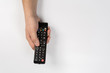 © Nana_studio - hand with tv remote control isolated on white background