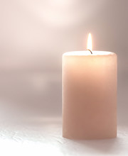 3d Rendering. Burning Candle Pastel Brown, Soft Blurred Focus.