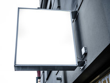 Mock Up. Outdoor Advertising, Blank Billboard Outdoors, Public Information Board On The Wall, Signboard Side View Of Empty White With Shadow Mock Up Signage.