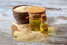 Bottle Of Sesame Oil And Sesame Seeds Isolated