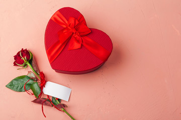 Wall Mural - St. Valentines Day concept. Fresh red roses and gift box