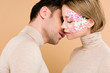 © LIGHTFIELD STUDIOS - tender man kissing pretty girlfriend with closed eyes isolated on beige