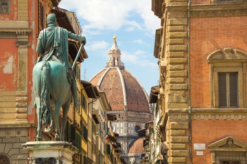 Wall Mural - Cathedral of Santa Maria del Fiore and Monument of Cosimo de Medici. View from the Piazza of the Santissima Annunziata. Beautiful sunny day in Florence, Italy.