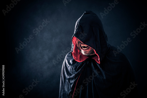 Fotomural Angry vampire with red cape showing his scary teeth