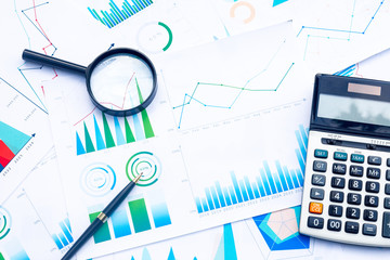 Calculator and Magnifying with Business Graphs finance document.