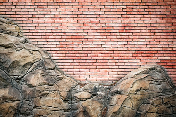 Wall Mural - Red brick wall with rocky-style decoration. Brick wall texture. Red brick background.