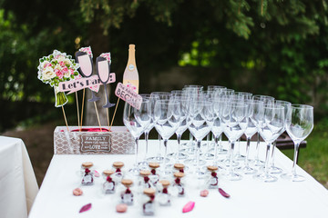 wedding reception table with champagne glasses and flowers