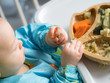 Baby eating by hands, Baby eating organic bio vegetables with BLW method, baby led weaning. Happy vegetarian kid eating lunch. Toddler eat himself, self-feeding. infant baby eating. 