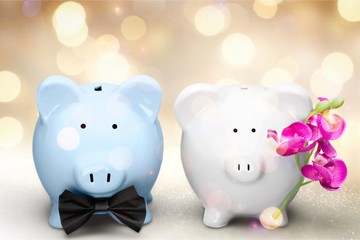 Poster - White and blue piggy banks on table on background