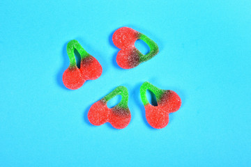 Poster - group of jelly candies on blue background