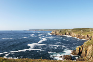 Ocean view to the blue horizon at a cliff in England's Land's End. Cornwall, UK