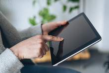Woman Holding Her Forefinger On Tablet Display