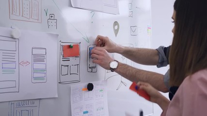 Web developers prototyping website layout