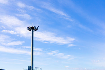 Light pole with blue sky on background